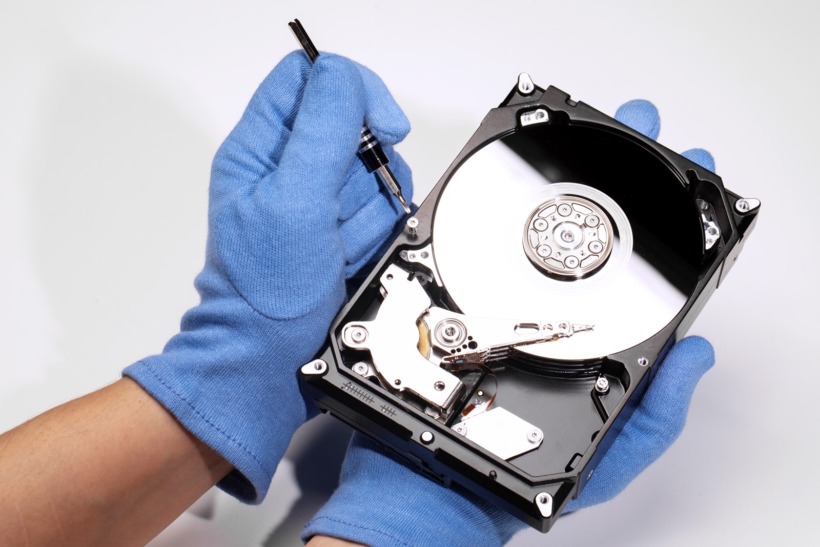 high-angle-hands-repairing-hard-drive.jpg